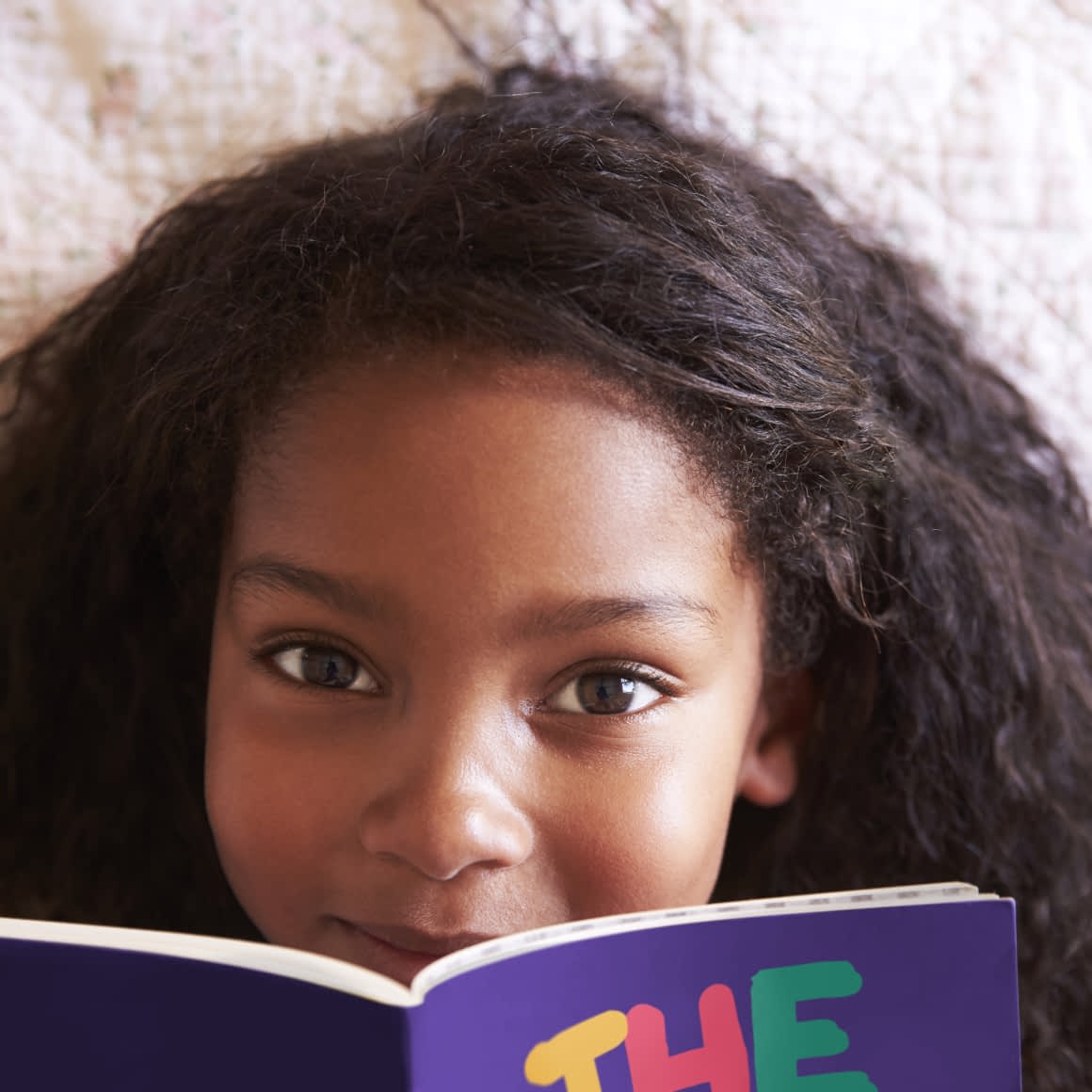 A Young Girl Reading The Green Club Recycling Pocket Guide